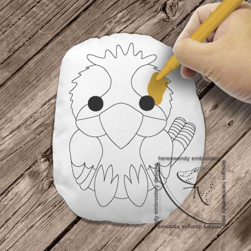 Cute kookaburra colouring stuffie ITH machine embroidery design with child's hand colouring it in